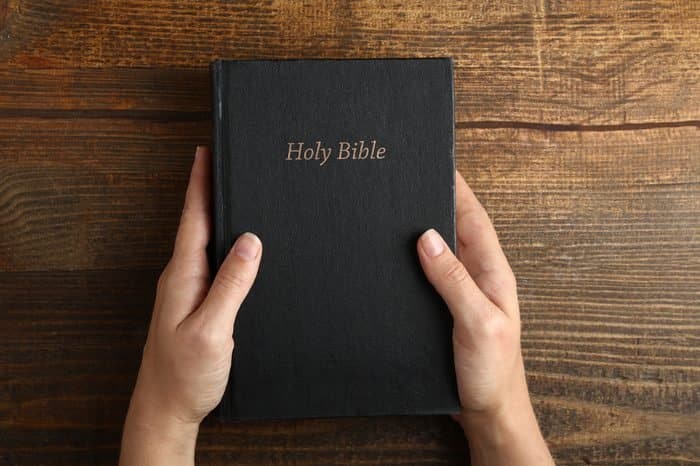 Hands holding Bible